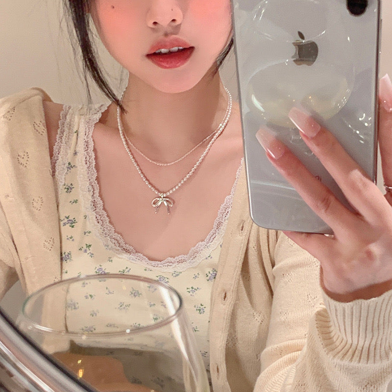 Double ribbon pearl necklace
