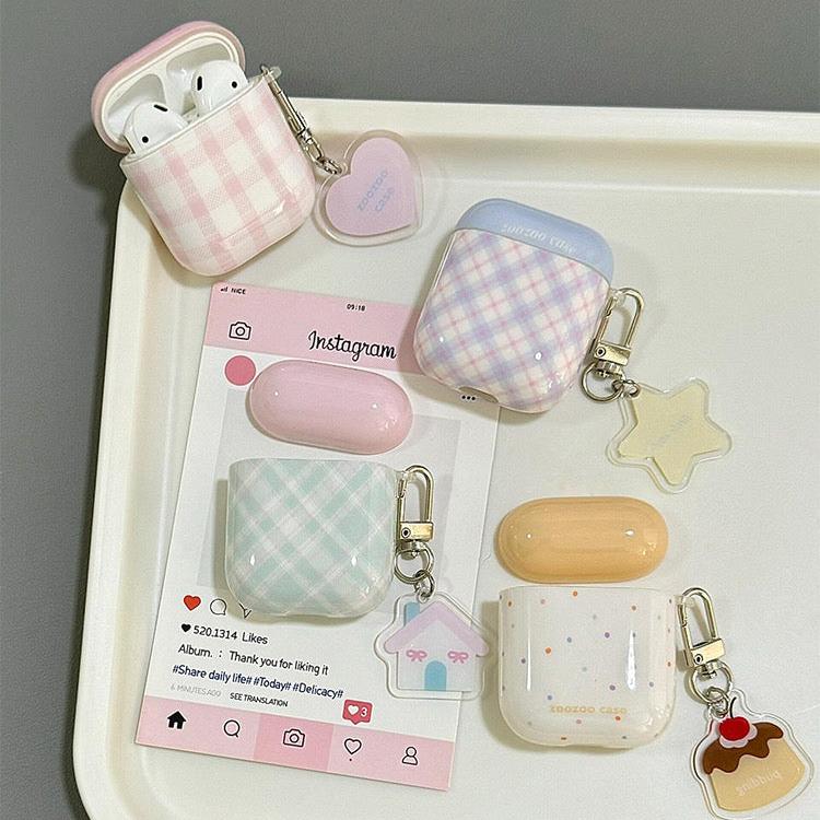Two-tone plaid AirPods case with keychain in yellow, blue, green, and pink. Compatible with AirPods Pro 2, AirPods 3, and AirPods 4.