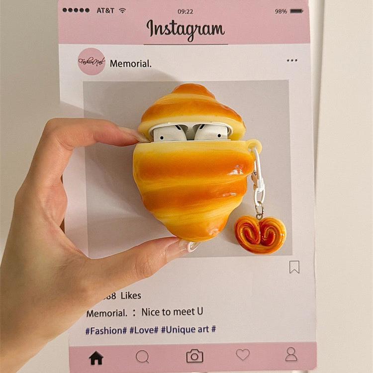 Croissant AirPods case with keychain. Compatible with AirPods Pro 2, AirPods 3, and AirPods 4.
