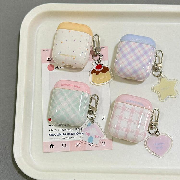 Two-tone plaid AirPods case with keychain in yellow, blue, green, and pink. Compatible with AirPods Pro 2, AirPods 3, and AirPods 4.