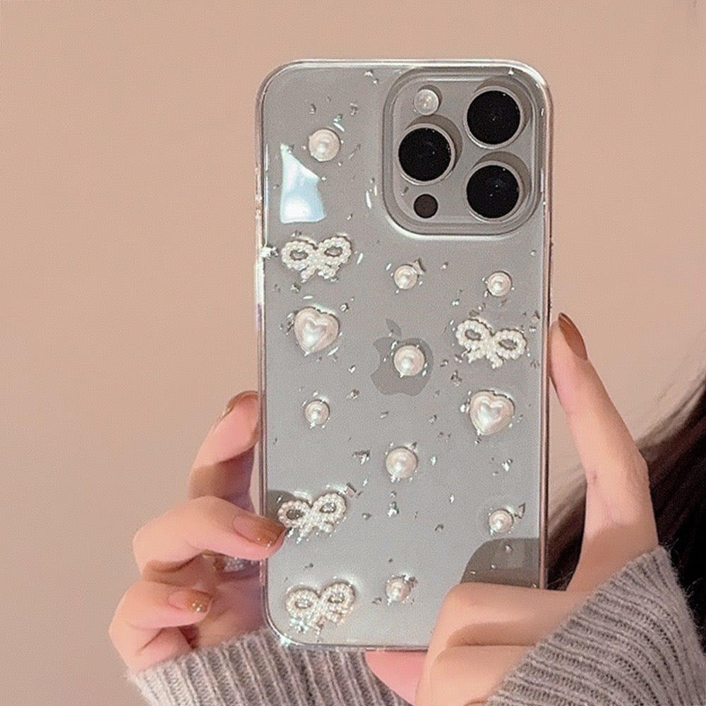 Transparent iPhone case with a pearl ribbon design, offering a stylish and protective look that enhances the phoneβs natural color.