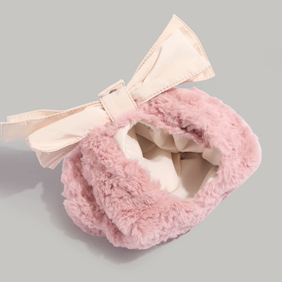 Pink furry bag with big ribbon
