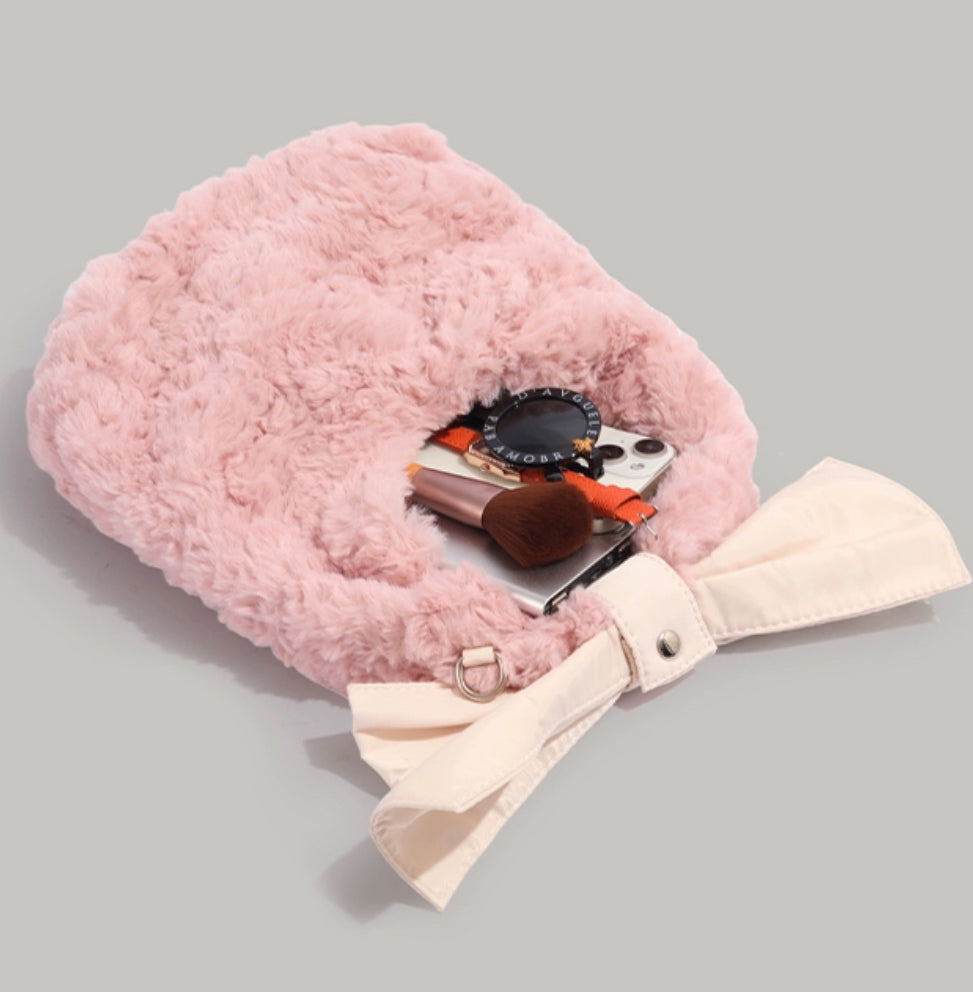 Pink furry bag with big ribbon
