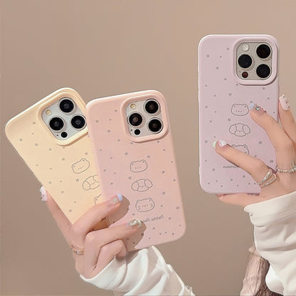 Pastel iPhone cases in pink and beige with cute bear and cat illustrations, decorated with small stars, offering stylish protection.