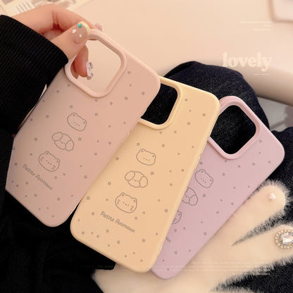 Pastel iPhone cases in pink and beige with cute bear and cat illustrations, decorated with small stars, offering stylish protection.