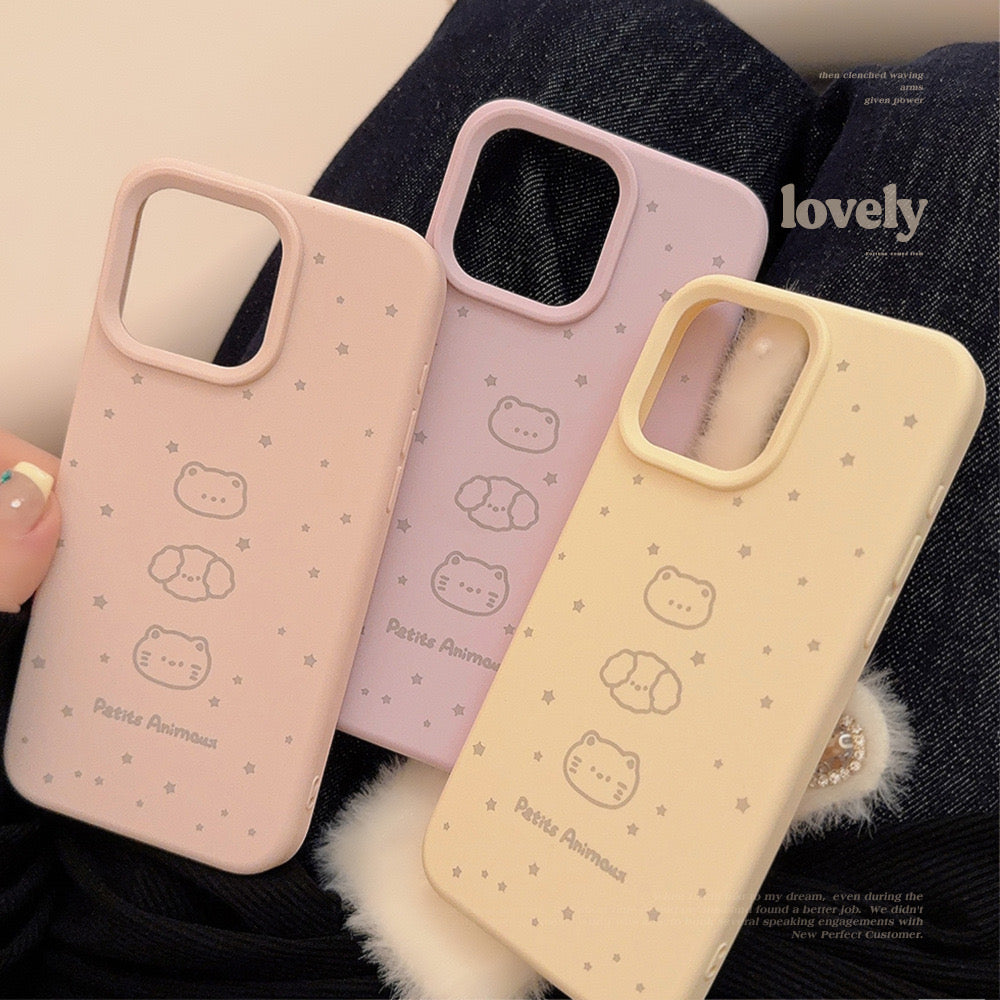 Pastel iPhone cases in pink and beige with cute bear and cat illustrations, decorated with small stars, offering stylish protection.