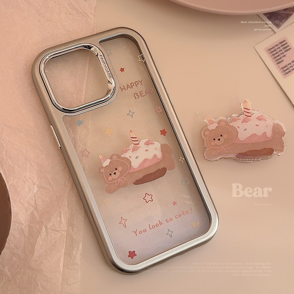 Happy Bear iPhone case with pastel design, featuring a cute bear on a dessert and a matching grip stand for convenience.